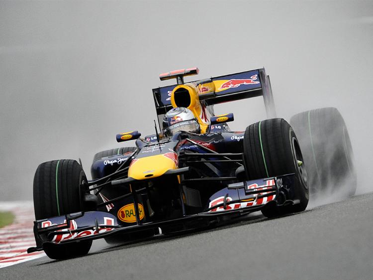 Sebastian Vettel drives in the rainy morning practice session for the Formula One Belgian Grand Prix at the Spa-Francorchamps circuit. (John Thys/AFP/Getty Images)