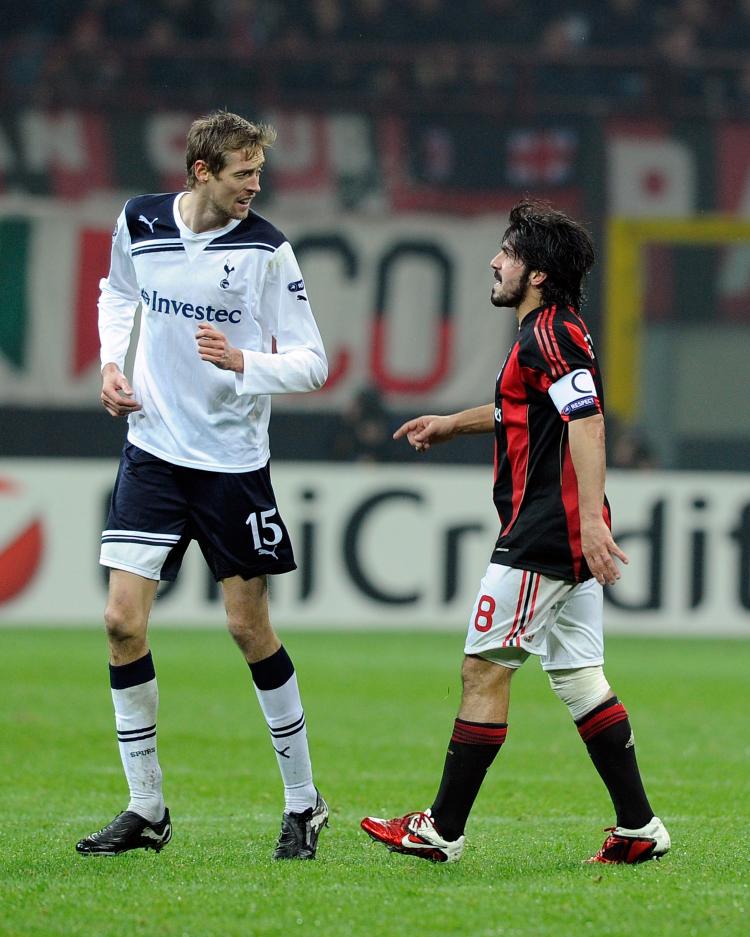 Tottenham striker Peter Crouch (L) kept his cool while Milan's Gennaro Gattuso lost his in Tuesday's Champions League action in Milan. (Claudio Villa/Getty Images)