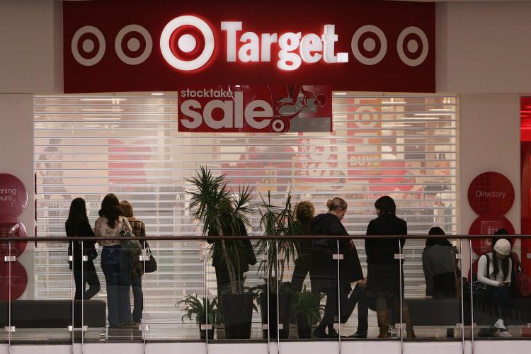 Shoppers wait outside a Target store at a shopping mall for the store opening. Target Corp., the second-largest discount retailer in the U.S., agreed to buy store leases for up to as many as 220 sites in Canada, now run by the Zellers Inc. department-stor (Gaye Gerard/Getty Images)