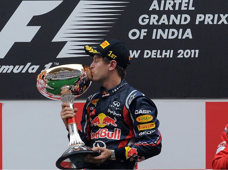 Red Bull-Renault driver Sebastian Vettel of Germany kisses the trophy after winning the Formula One Indian Grand Prix. (Prakash Singh/AFP/Getty Images)