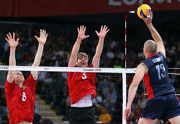 Marcus Bohme #8 and Sebastian Schwarz #3 of Germany go up to block a shot by Clayton Stanley #13 of United States during Men's Volleyball on Day 4 of the London 2012 Olympic Games. (Elsa/Getty Images)