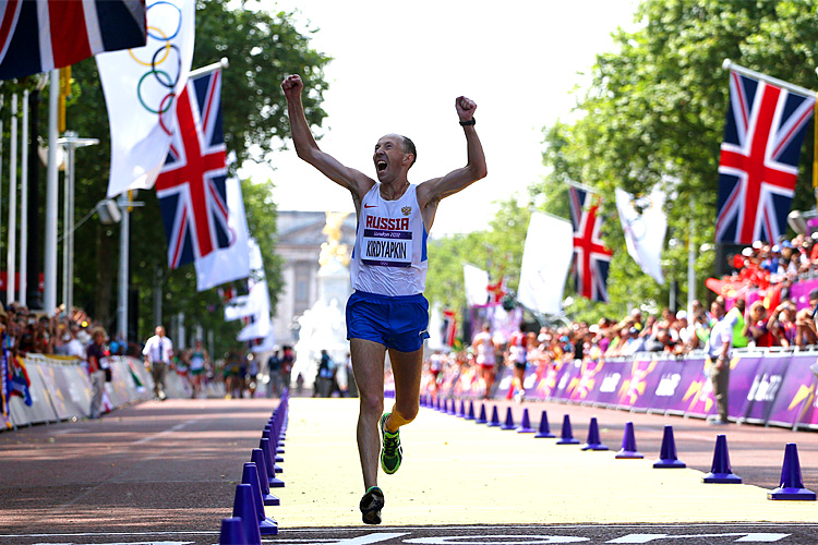 Sergey Kirdyapkin of Russia crosses the line to win gold during the Men's 50km Walk on Day 15 of the London 2012 Olympic Games. (Streeter Lecka/Getty Images)