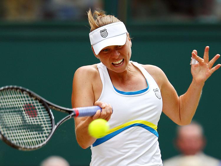 Vera Zvonareva plays a shot during the Wimbledon Ladies Semi Final match against Tsvetana Pironkova. (Clive Brunskill/Getty Images)