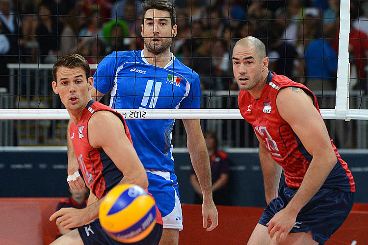 US player Clayton Stanley (R) and Russell Holmes (L) of the U.S. watch a ball go past them during the Men's quarterfinal volleyball match between the U.S. and Italy in the 2012 London Olympic Games. (Kirill Kudryavtsev/AFP/GettyImages)