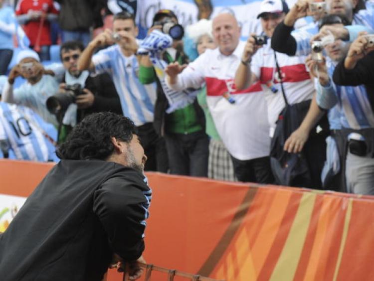 Argentina's coach Diego Maradona greets fans prior to Argentina vs Nigeria match on June 12, 2010 at Ellis Park stadium in Johannesburg.  (Daniel Garcia/AFP/Getty Images)