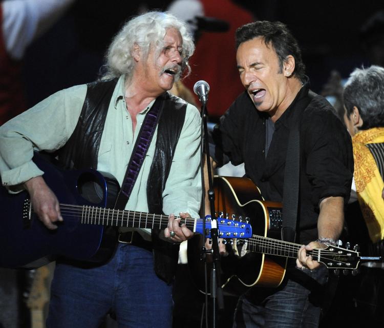 Arlo Guthrie (L) and Bruce Springsteen (R) perform during a concert for folk music legend Pete Seeger's 90th birthday at Madison Square Garden in New York on May 3, 2009. Guthrie is slated to perform at the Macy's Thanksgiving Day Parade this year. (Timothy A. Clary/AFP/GETTY IMAGES)