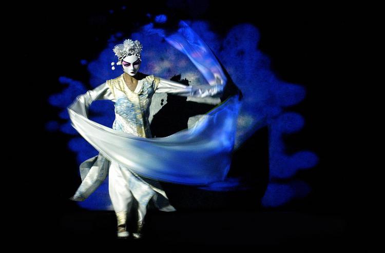 A dancer performs during a press rehearsal of Canadian author, director and actor Robert Lepage's creation 'The Blue Dragon.' (Alain Julien/AFP/Getty Images)