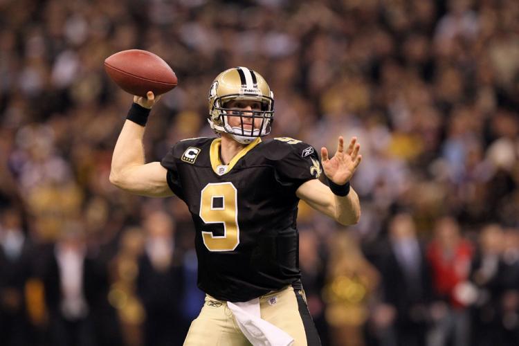 Drew Brees of the New Orleans Saints throws a pass against the Minnesota Vikings during the 2009 NFC Championship Game. Brees will be on the cover of the EA Sports Madden NFL 2011 video game. (Jed Jacobsohn/Getty Images)