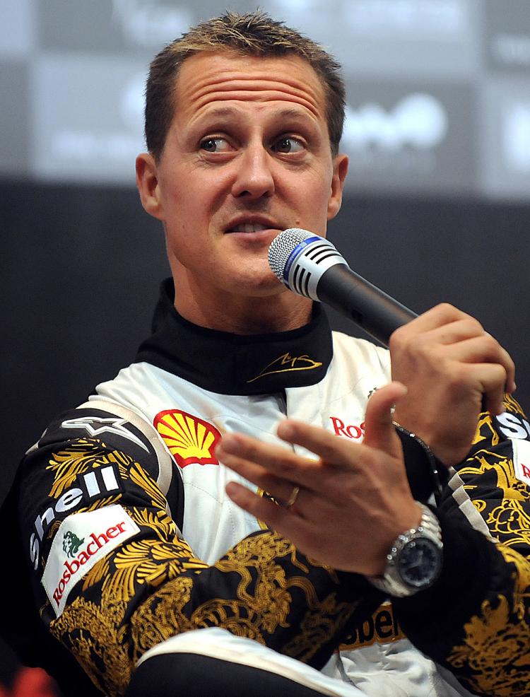 Seven-time F1 world champion Michael Schumacher responds to reporters' questions, November 3, 2009, before the 2009 Race of Champions. (Frederic J. Brown/AFP/Getty Images)