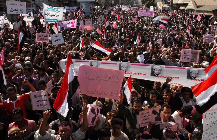 Day of Rage: Yemeni anti-government protesters hold banners against President Ali Abdullah Saleh's rule as they gather in Sana'a for a 'day of rage' on Thursday, Feb 3. (GAMAL NOMAN/AFP/Getty Images)