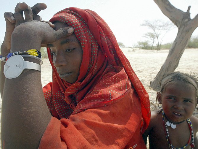 Depressed nomadic housewife Fatima Usman sits facing away from her son Hadija as the family prepares to move away from the Woudi Desert Camp in Niger on Oct. 28, 2006. Experts discussed the rising global rates of depression, often triggered by poverty and homelessness, at the U.N. on World Health Day Oct. 10. (Pius Utomi Ekpei/AFP/Getty Images)