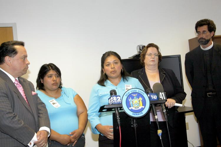 State Senator Pedro Espada (L) joined by farm workers Carmen Gonzaleas, Maura Gonzaleas, Assemblywoman Cathy Nolan and Reverend Richard Witt, Director of Rural & Migrant Ministry at a press conference on Tuesday. (Shi Lixin/The Epoch Times)