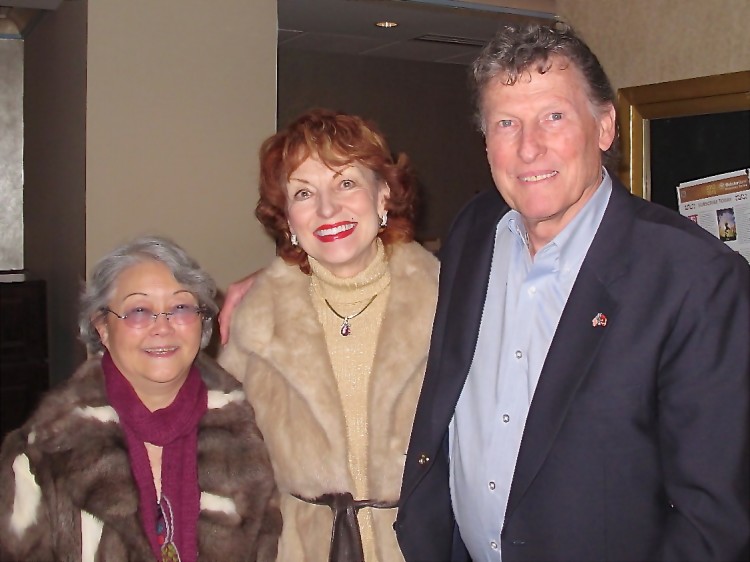 Patulla Comstock (C) with her husband, Charles, and her friend attend Shen Yun