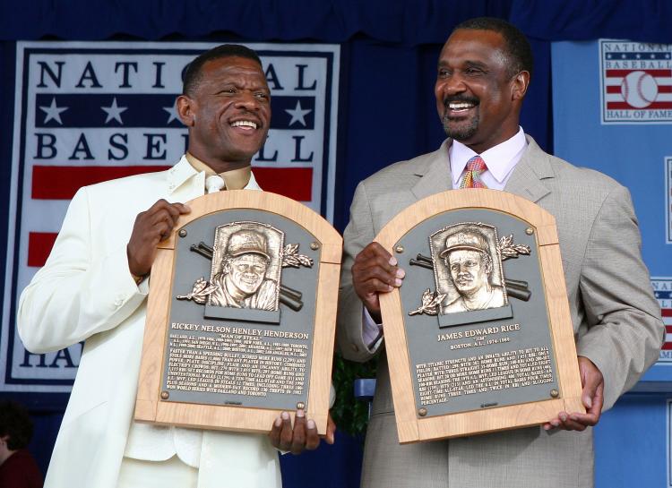 HALL OF FAMERS: Rickey Henderson brings the stats and Jim Rice brings the compassion to Cooperstown. (Jim McIsaac/Getty Images)