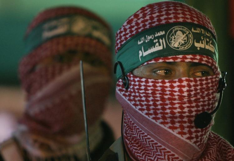 Hamas militants at a Feb. 17 rally in the Gaza Strip to honor the movement's assassinated top commander Mahmoud al-Mabhouh. Al-Mabhouh was assassinated last month in Dubai by a professional hit squad of at least 11 people carrying forged European passport (Mahmud Hams/AFP/Getty Images)