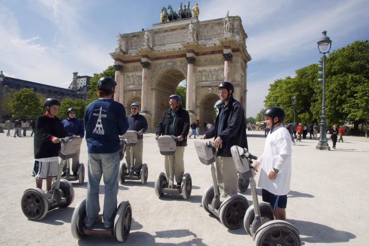 Jimmy Heselden, the owner of the two-wheeled gyroscopic Segway company, died while riding one. Pictured above, US tourists visit Paris with the City Segway Tours in April 2004. (Alex Wong/Getty Images)