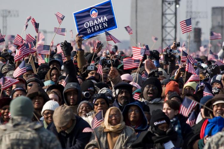 CELEBRATING HISTORY: People celebrate at the Inauguration of President Barack Obama on Tuesday in Washington, D.C. (Jeff Nenarella/The Epoch Times)