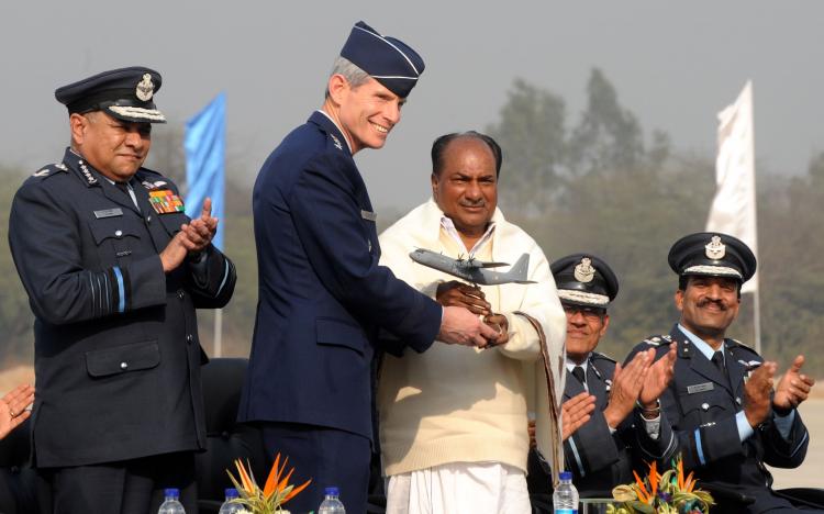 THE REAL DEAL: Chief of staff of the U.S. Air Force Gen. Norton A. Schwartz (2L) presents a replica of the C-130 Super Hercules to Indian Defense Minister A.K. Antony (3L) during an inauguration ceremony for the first of the six Lockheed Martin C-130J Sup (RAVEENDRAN/AFP/Getty Images)