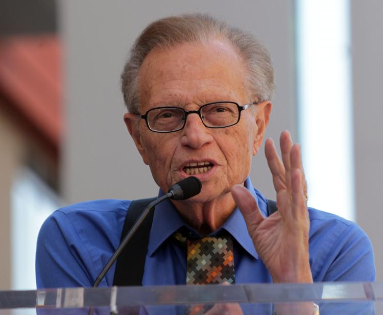 Larry King poses for photographers during the installation ceremony for Bill Maher's star on The Hollywood Walk of Fame on Sept. 14 in Hollywood, California. (Frederick M. Brown/Getty Images)