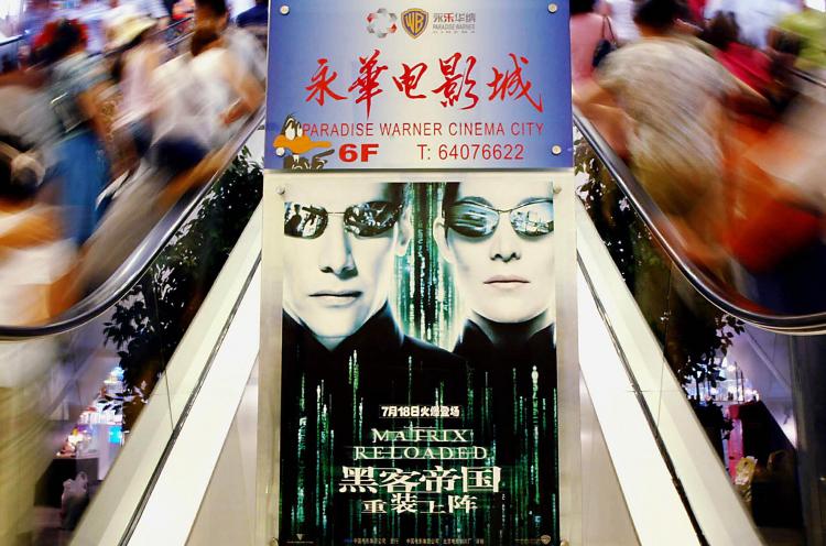 Chinese cinemagoers flock to the new Shanghai's Paradise Cinema for the premier of 'The Matrix Reloaded' in Shanghai 13 July 2003.   (STR/Getty Images)