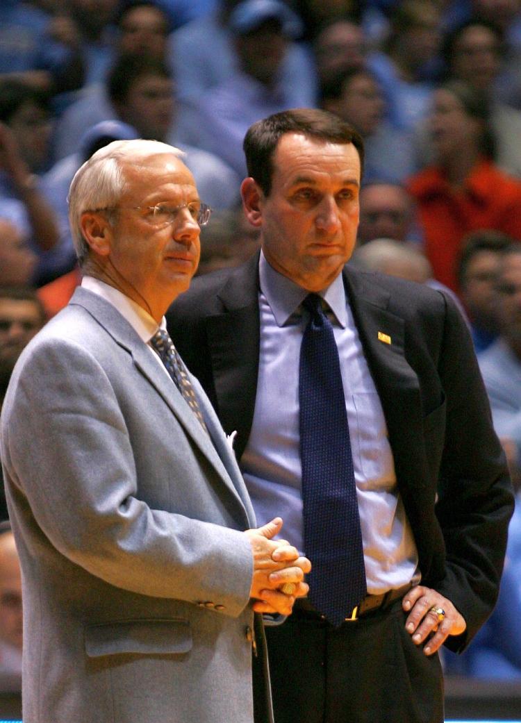 PAST CHAMPS: Head coach Mike Krzyzewski (R) of the Duke Blue Devils, who won the NCAA title last year, and head coach Roy Williams of the University of North Carolina Tar Heels, who clinched the title two years ago, are seen in Chapel Hill, N.C., in this file photo.  (Streeter Lecka/Getty Images)