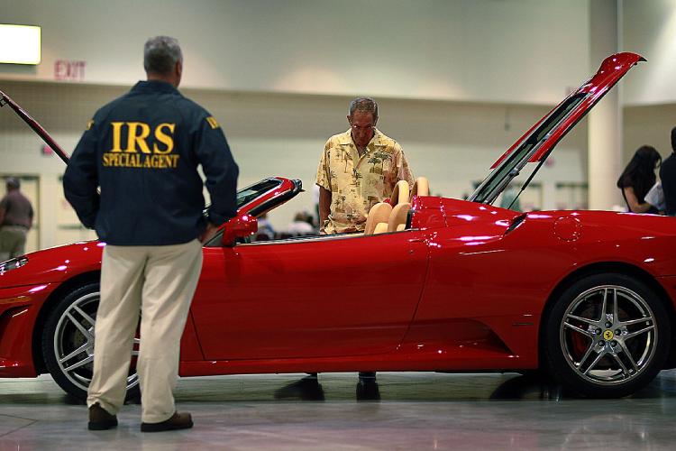 A 2006 Ferrari F430 Spyder belonging to Ponzi schemer Scott Rothstein is put on auction on behalf of the U.S. Dept. of the Treasury at the Broward County Convention center on June 3, 2010 in Fort Lauderdale, Florida. (Joe Raedle/Getty Images)