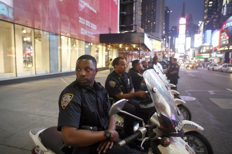 NYPD officers at Times Square in New York City. Violent crime declined 4.4 percent nationally, while property crime decreased 6.1 percent, according to an FBI report. (Michael Nagle/Getty Images)