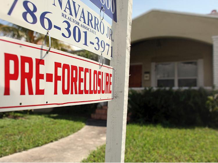 One of every four homeowners owes more on the mortgage than the value of the home. (Joe Raedle/Getty Images)