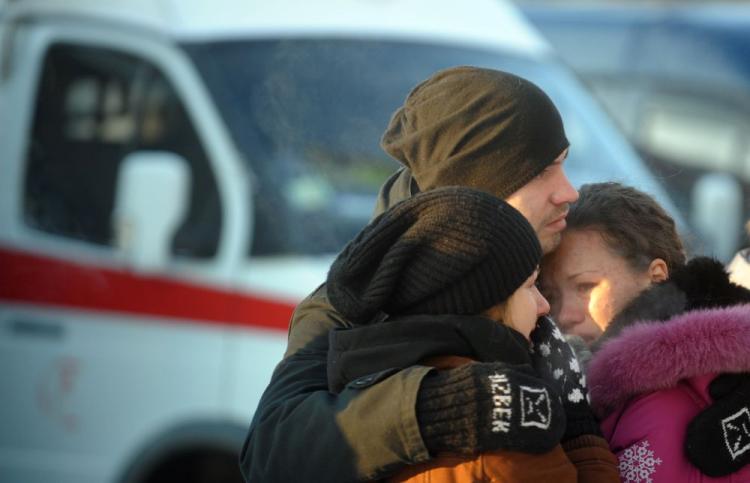 Relatives of the victims killed in the fire inside the Lame Horse restaurant cry near a morgue in Perm. Russian President Dmitry Medvedev called for a 'full punishment' and accused the club's management of gross negligence.  (Dmitry Kostyukov/AFP/Getty Images)