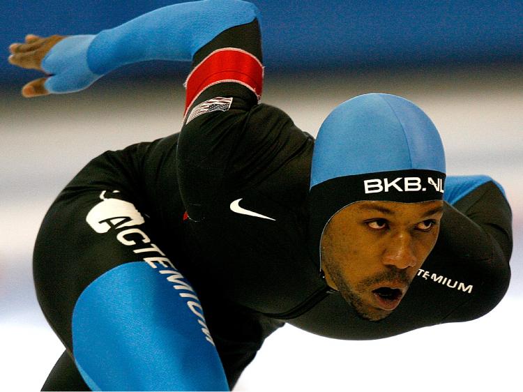 FLYING ON ICE: Shani Davis competes in the 1000 m event during the U.S. Speedskating Championships in Utah in December. (Matthew Stockman/Getty Images)