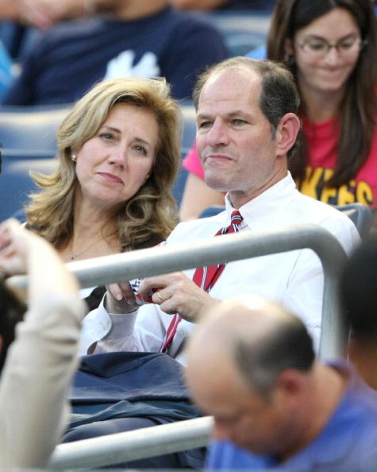 Former New York Governor Eliot Spitzer and wife Silda Wall Spitzer attend the New York Yankees game against the Texas Rangers on August 25, 2009 at Yankee Stadium in the Bronx borough of New York City. (Al Bello/Getty Images)