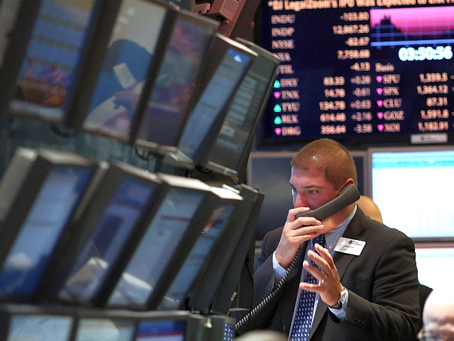 A trader works on the floor of the New York Stock Exchange