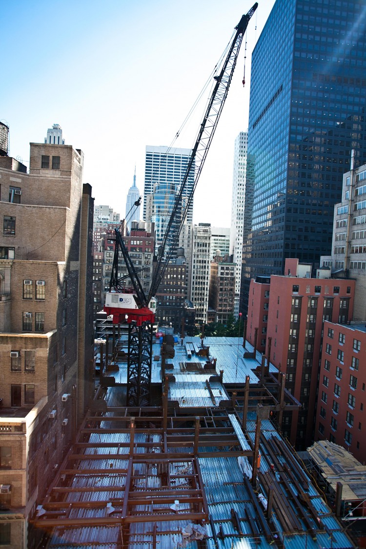 HIGH RISE: The International Gem Tower on 47th Street in Midtown is one of many building projects across the city that nearly halted in its tracks as construction contracts expired and negotiations were tense.   (Amal Chen/The Epoch Times)