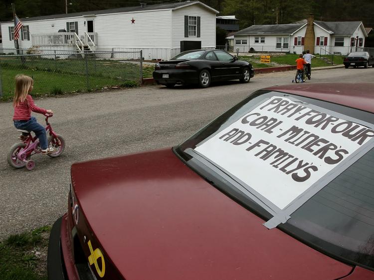 A sign that reads 'Pray For Our Miners And Families' is taped to the back window of a car on April 8, 2010 in Whitesville, West Virginia. The search for three unaccounted miners has been suspended due to dangerous gasses trapped underground. (Mark Wilson/Getty Images)