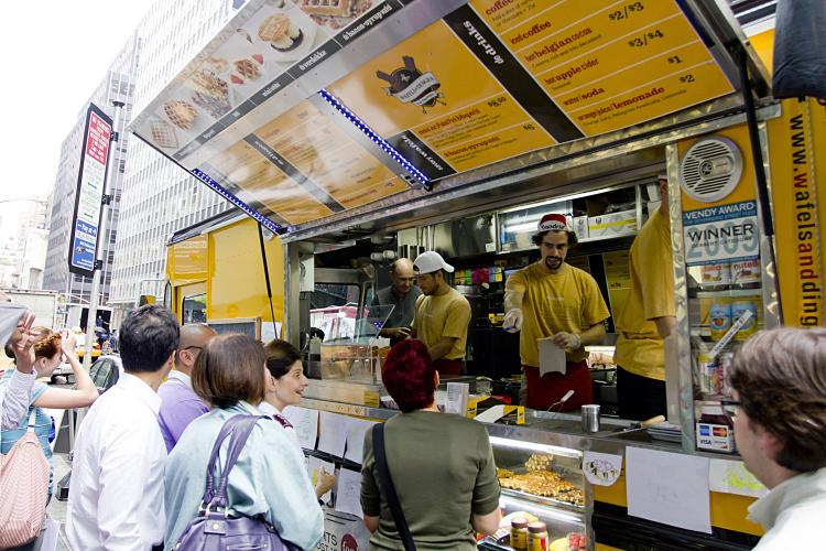 WAFFLE LOVERS: Fans of the food truck 'Wafels and Dinges' lined up to compete for the titles of Mr. and Miss Wafel- which includes a year of free waffles from the popular food truck.