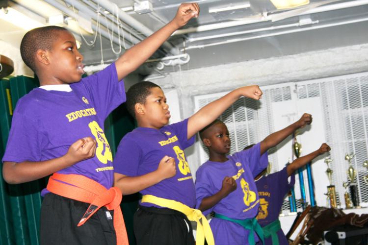 Harlem kids learn the old school karate way, which focuses on shaping a strong mind and moral character as well as the karate techniques. The teacher, Master Thorton believes the values of karate discipline can help turn youth in the community away from n (Katy Mantyk/The Epoch Times)