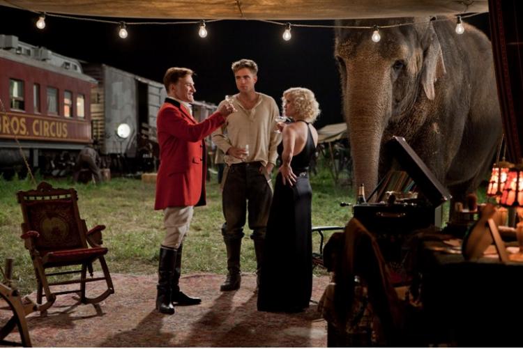 LOVE QUADRILATERAL: Christoph Waltz, Robert Pattinson, Reese Witherspoon, and Rosie the elephant in a scene from the film Water for Elephants. (David James/Twentieth Century Fox Film Corp.)