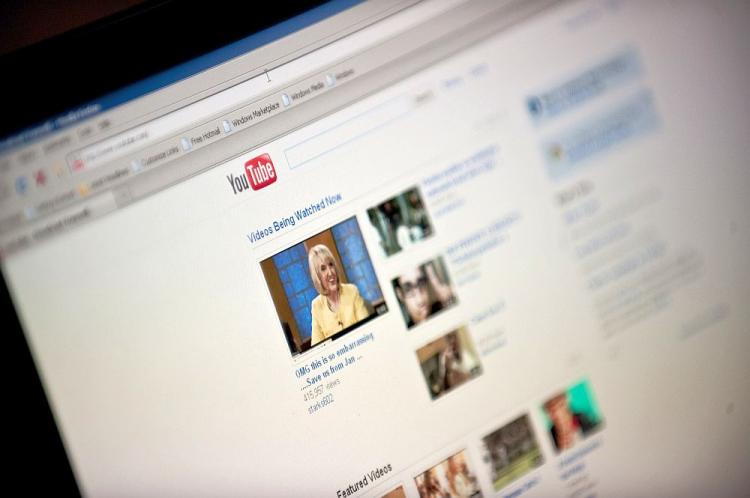 The YouTube homepage appears on a screen in Washington on Sept. 3. YouTube Chief Executive Officer Chad Hurley said he is stepping down from his position at the company. (Nicholas Kamm/AFP/Getty Images )