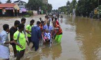 People Plucked From Rooftops as Indian Floods Kill 324