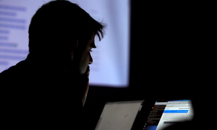 A man takes part in a hacking contest during the Def Con hacker convention in Las Vegas, Nevada, U.S. on July 29, 2017. (Reuters/Steve Marcus)