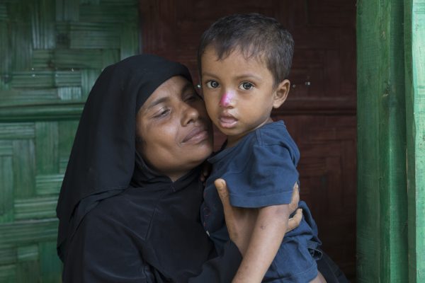 Rehena Begum, 35, and son Jamal Hussain, 2, pose for a photo at a CARE-provided women-friendly space in Potibunia Camp, Coxâs Bazar, Bangladesh, on May 18, 2018. (Aungmakhai Chak/DEC)