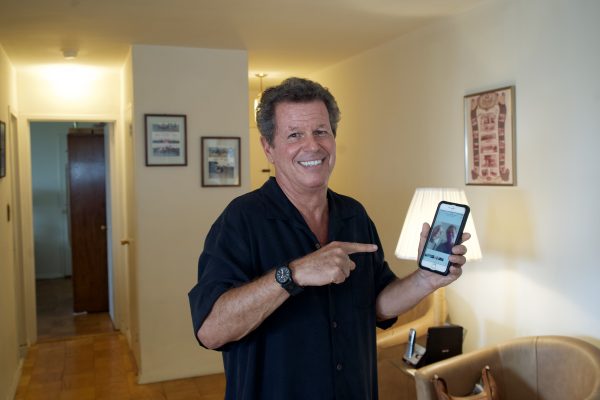 Ronnie Tishkevich pointing at a picture of him and Michael