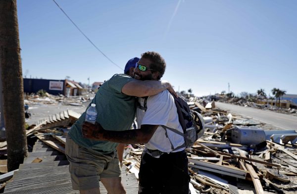 hugged friend reunite Hurricane Michael