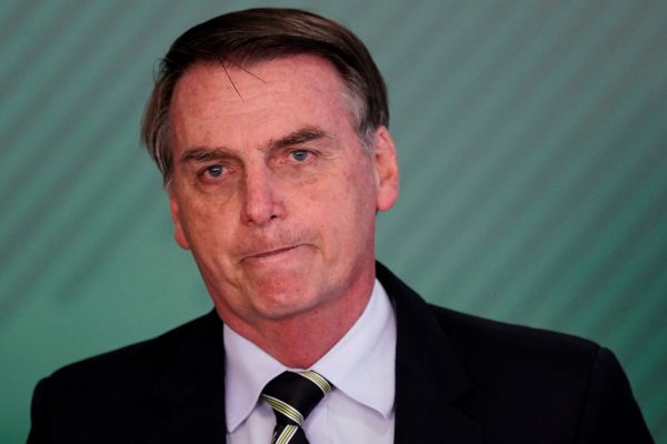 Brazil's President Jair Bolsonaro reacts during a signing ceremony of the decree which eases gun restrictions in Brazil, at the Planalto Palace in Brasilia, Brazil, Jan. 15, 2019. (Reuters/Ueslei Marcelino)