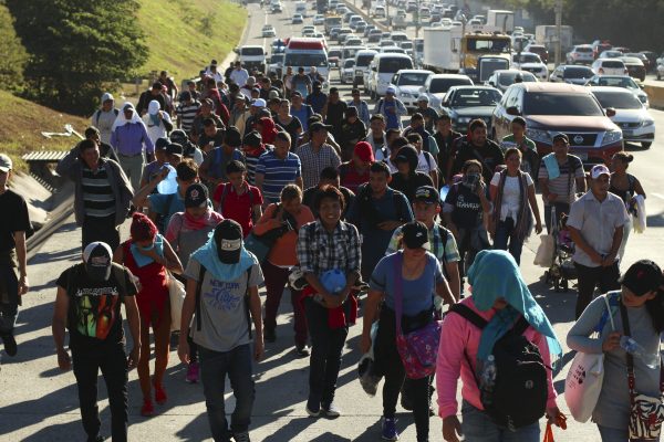 Migrants-traveling-in-a-group-begin-their-journey-toward-the-U.S.-border-as-they-walk-along-a-highway-in-San-Salvador-El-Salvador-early-Wednesday-Jan.-16-2019-Salvador-Melendez.AP_-600x400.jpg