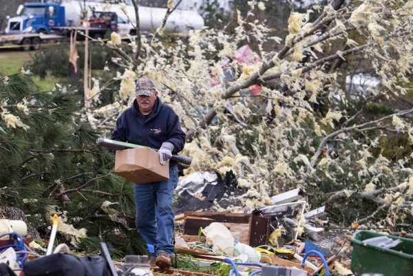 man salvages belongings