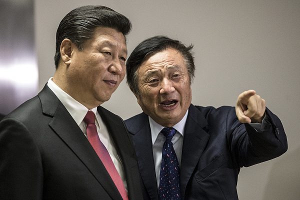 Huawei President Ren Zhengfei (R) shows Chinese leader Xi Jinping around