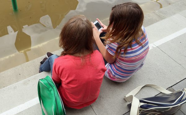 Girls discuss smartphone