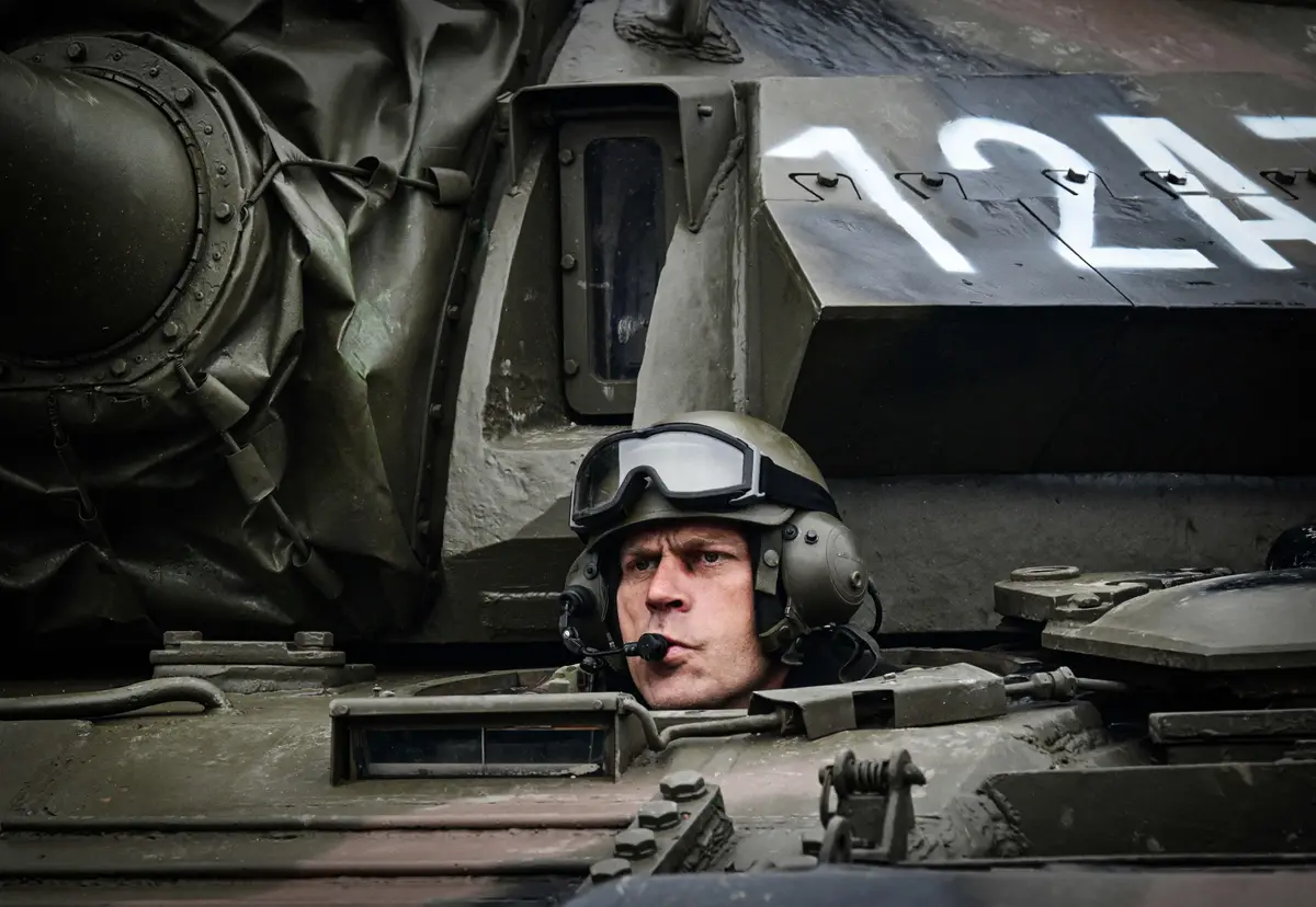 Day in Photos: Military Parade in Romania, White House Christmas Decorations, and a Newborn Baby Gorilla thumbnail