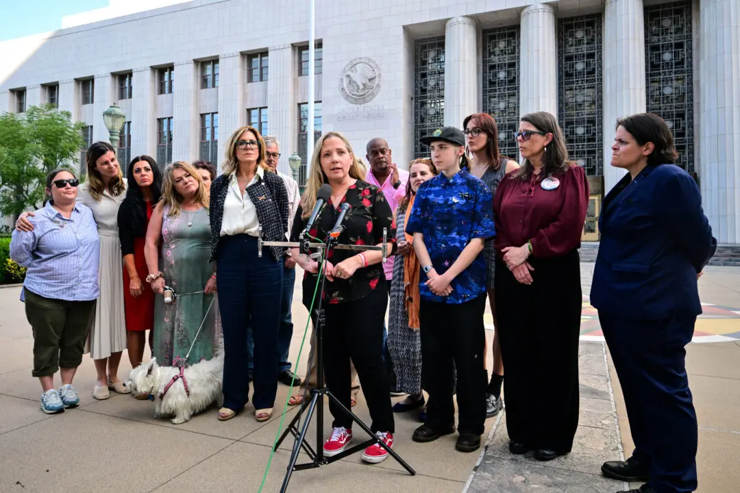 Amy Neville (C), whose son died after taking a pill bought on social media which was laced with fentanyl, speaks outside Los Angeles Superior Court during a trial examining whether social media companies deliberately designed their platforms to be addictive to children, in Los Angeles on March 12, 2026. (Frederic J. Brown / AFP via Getty Images)